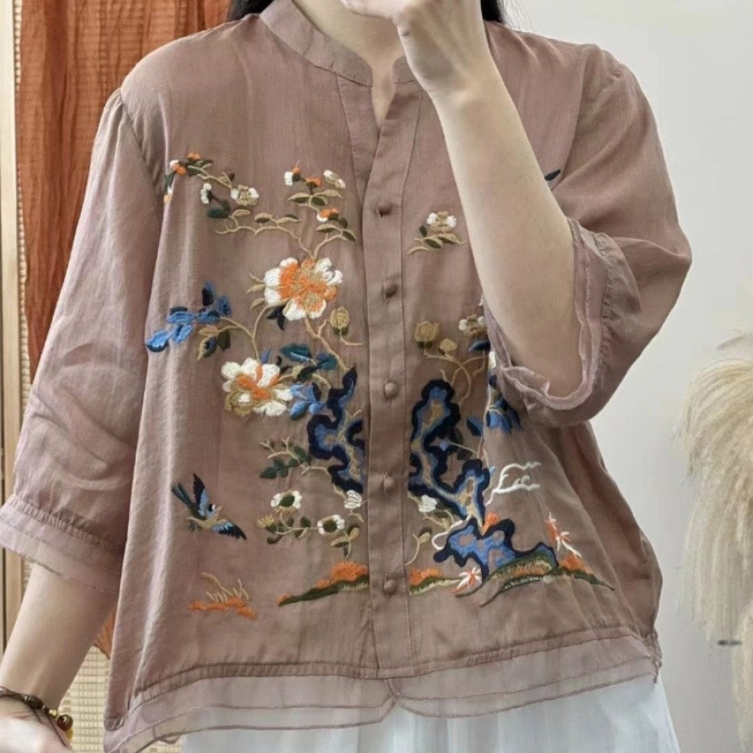 Close-up of embroidery detail on organic cotton top